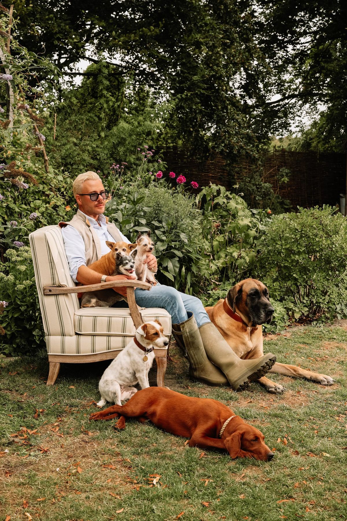 James in the garden with a few of his dogs